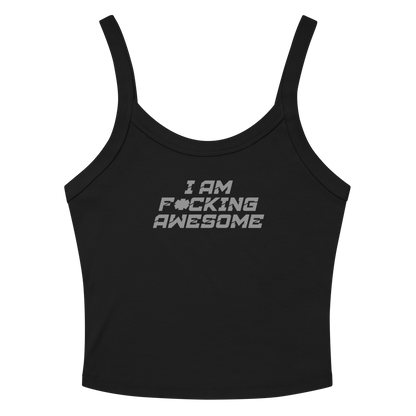"I Am F*cking Awesome" printed on a solid black blend women's micro-rib tanktop laying on a flat surface amongst sunglasses and shorts