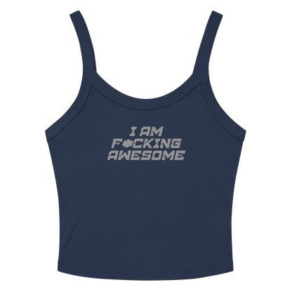 "I Am F*cking Awesome" printed on a solid navy blend women's micro-rib tanktop laying on a flat surface amongst sunglasses and shorts