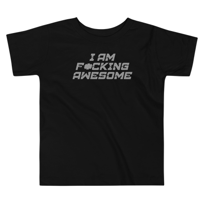 "I Am F*cking Awesome" printed on a black toddler short sleeve tee laying on a flat surface