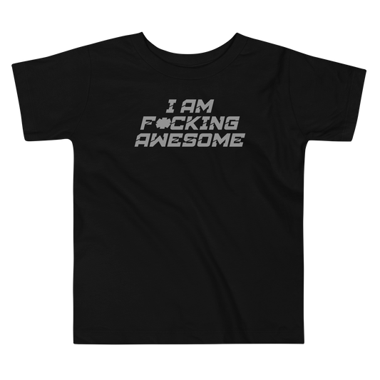 "I Am F*cking Awesome" printed on a black toddler short sleeve tee laying on a flat surface