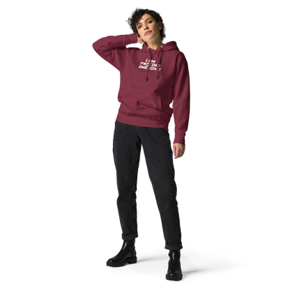 "I Am F*cking Awesome" printed on a maroon unisex hoodie worn by a female