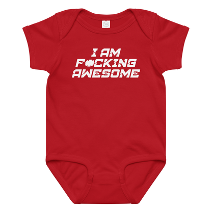 "I Am F*cking Awesome" printed on a red baby jersey bodysuit laying on a flat surface amongst other clothes