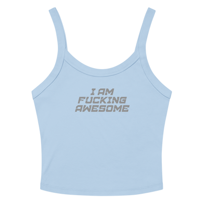 "I Am Fucking Awesome" printed on a solid baby blue blend women's micro-rib tanktop laying on a flat surface amongst sunglasses and shorts