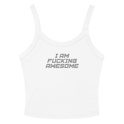 "I Am Fucking Awesome" printed on a solid white blend women's micro-rib tanktop laying on a flat surface amongst sunglasses and shorts