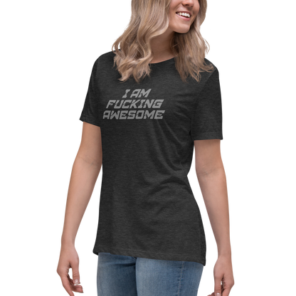 "I Am Fucking Awesome" printed on a dark grey heather women's relaxed t-shirt worn by a female