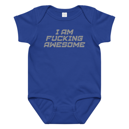 "I Am Fucking Awesome" printed on a royal baby jersey bodysuit laying on a flat surface amongst other clothes