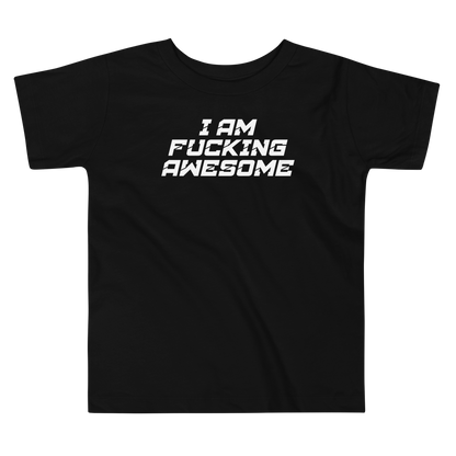 "I Am Fucking Awesome" printed on a black toddler short sleeve tee laying on a flat surface