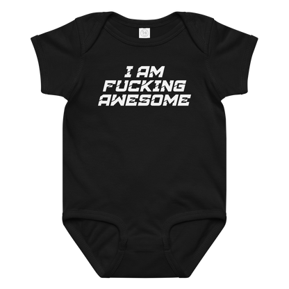 "I Am Fucking Awesome" printed on a black baby jersey bodysuit laying on a flat surface amongst other clothes