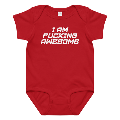 "I Am Fucking Awesome" printed on a red baby jersey bodysuit laying on a flat surface amongst other clothes