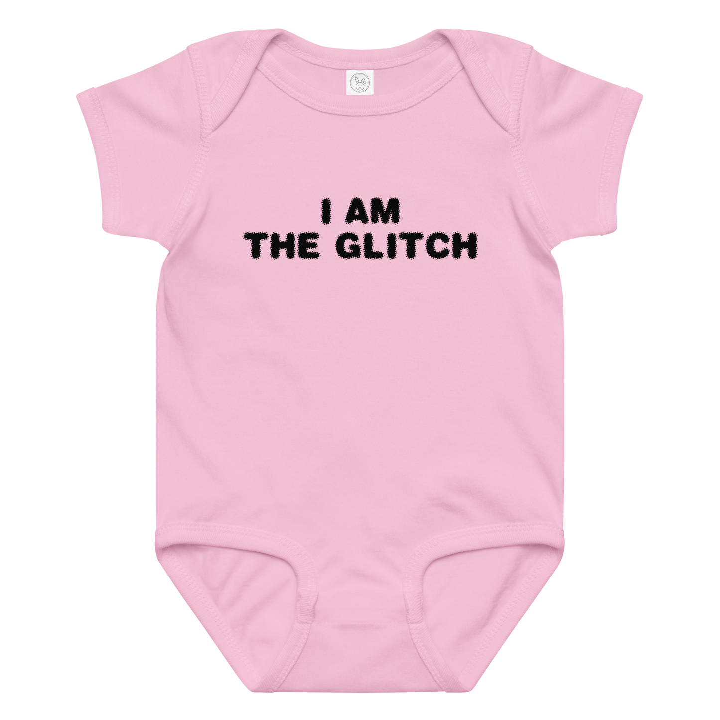 "I am the glitch" printed on a pink baby jersey bodysuit laying on a flat surface amongst other clothes