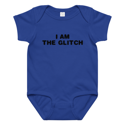 "I am the glitch" printed on a royal baby jersey bodysuit laying on a flat surface amongst other clothes