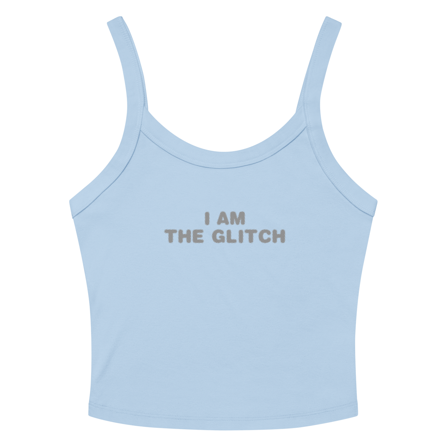 "I am the glitch" printed on a solid baby blue blend women's micro-rib tanktop laying on a flat surface amongst sunglasses and shorts