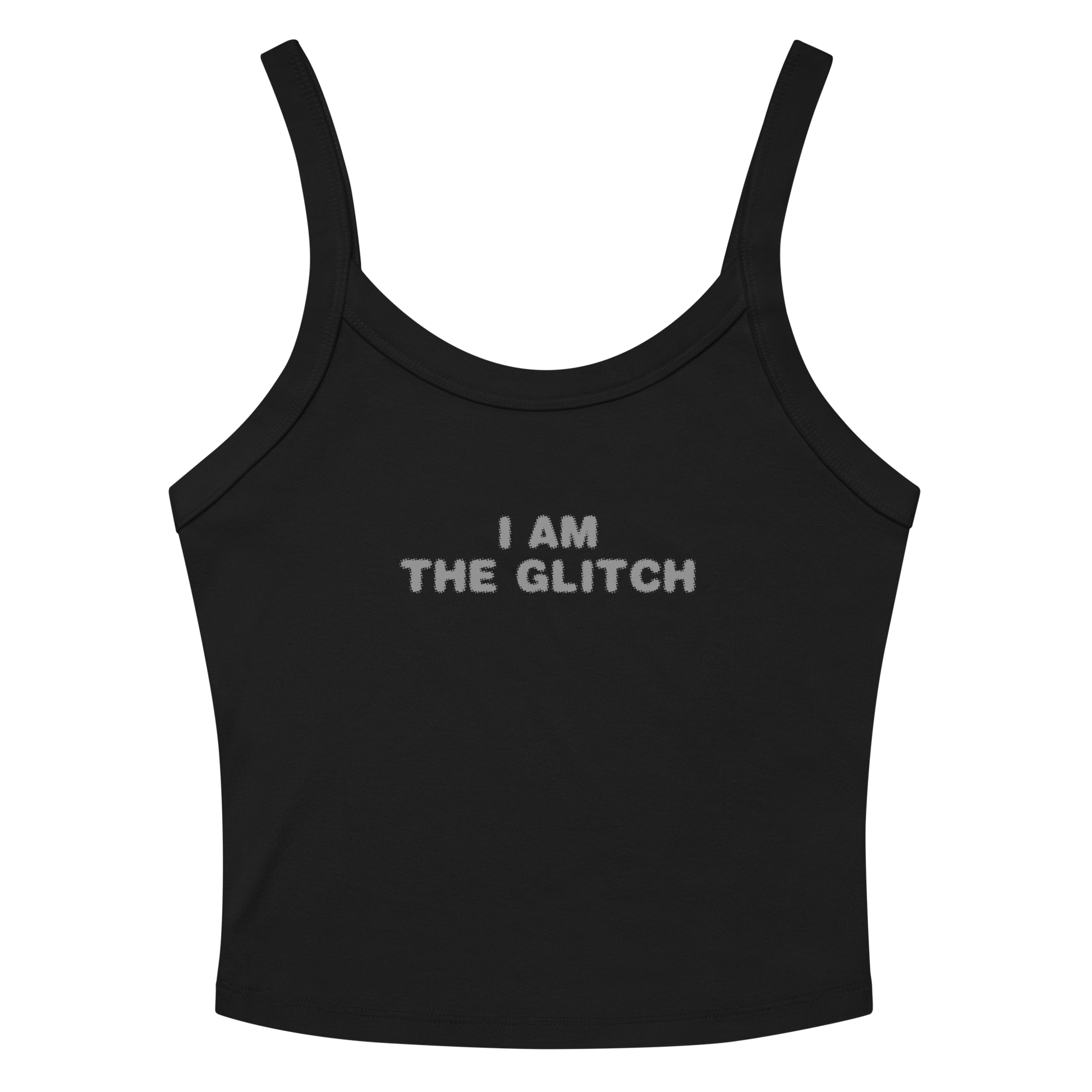 "I am the glitch" printed on a solid black blend women's micro-rib tanktop laying on a flat surface amongst sunglasses and shorts