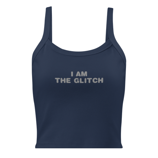 "I am the glitch" printed on a solid navy blend women's micro-rib tanktop laying on a flat surface