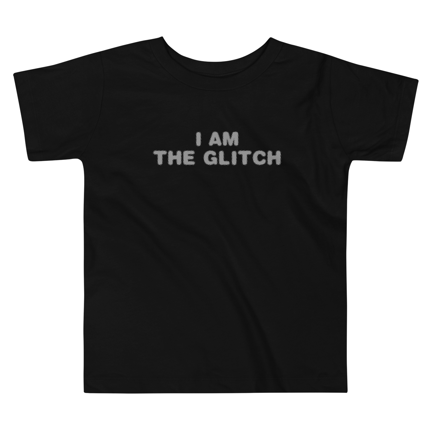 "I am the glitch" printed on a black toddler short sleeve tee laying on a flat surface