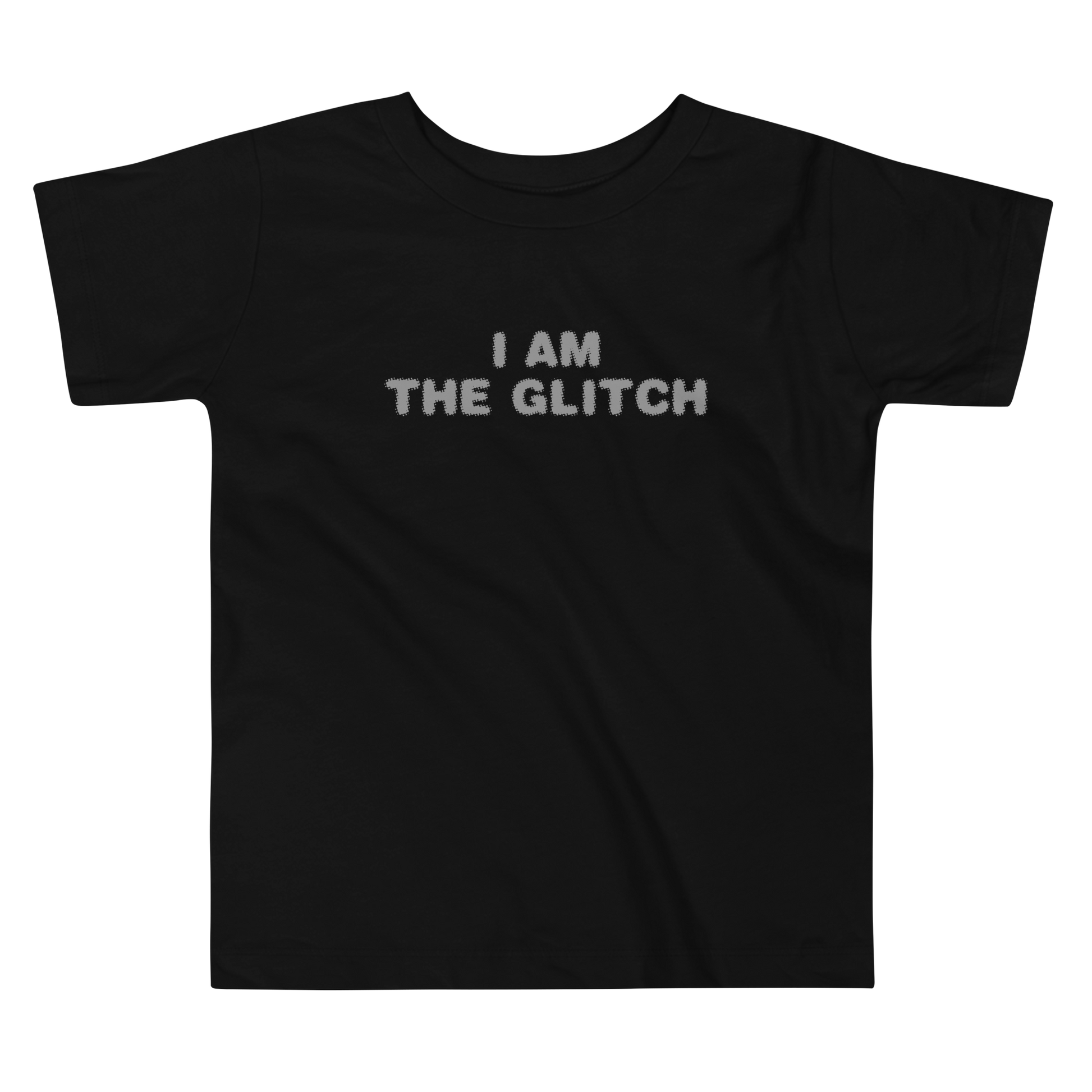 "I am the glitch" printed on a black toddler short sleeve tee laying on a flat surface