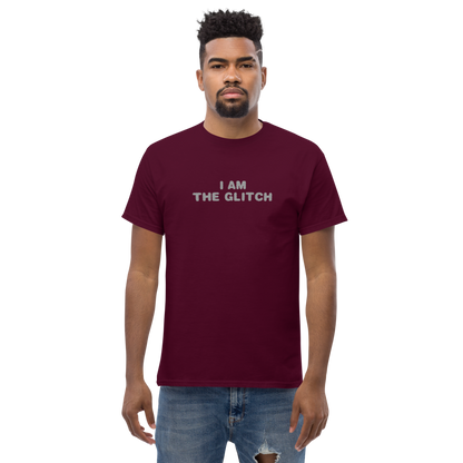 "I am the glitch" printed on a maroon unisex classic tee worn by a male