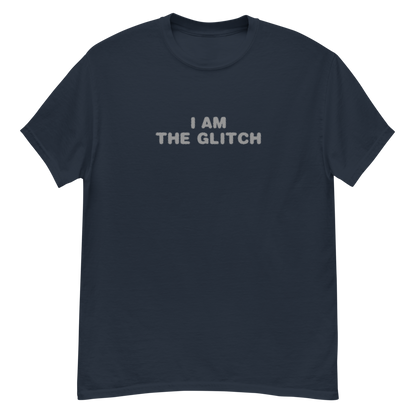 "I am the glitch" printed on a navy unisex classic tee laying on a flat surface