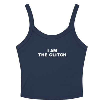 "I am the glitch" printed on a solid navy blend women's micro-rib tanktop laying on a flat surface amongst sunglasses and shorts