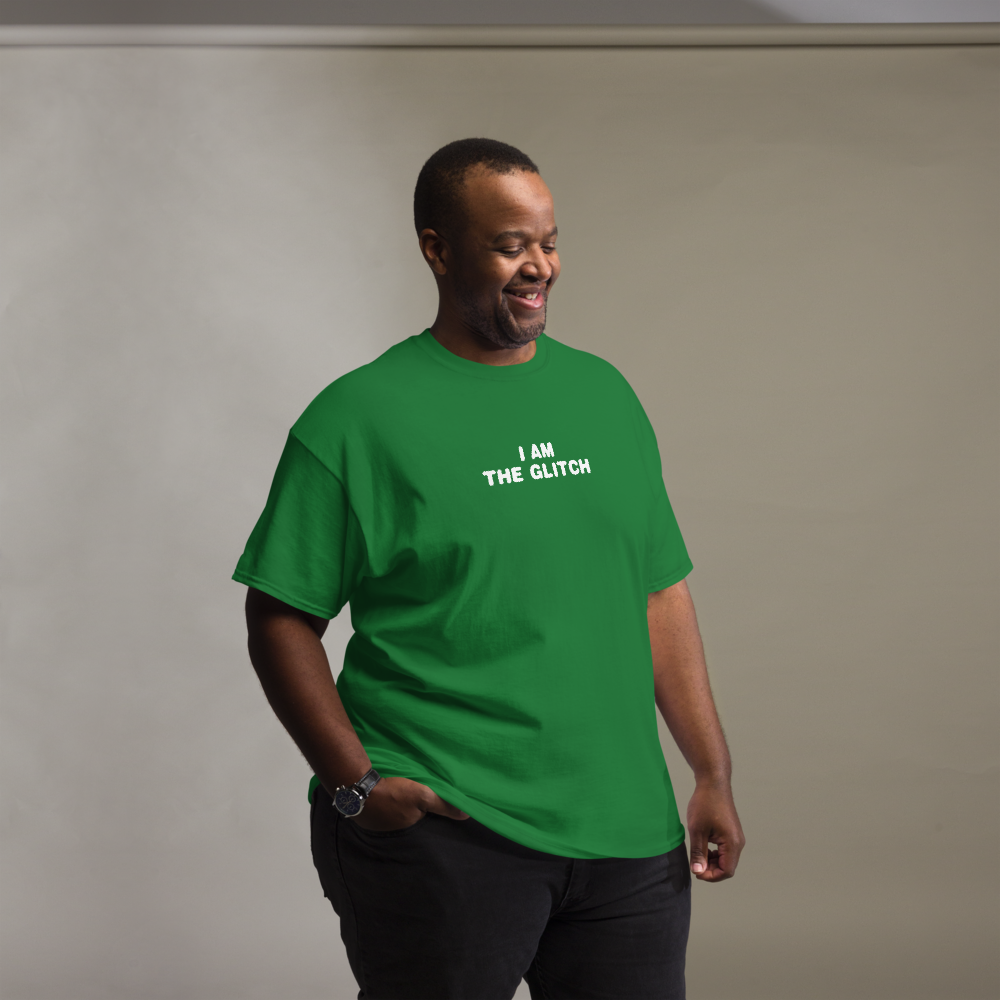 "I am the glitch" printed on a turf green unisex classic tee worn by a male