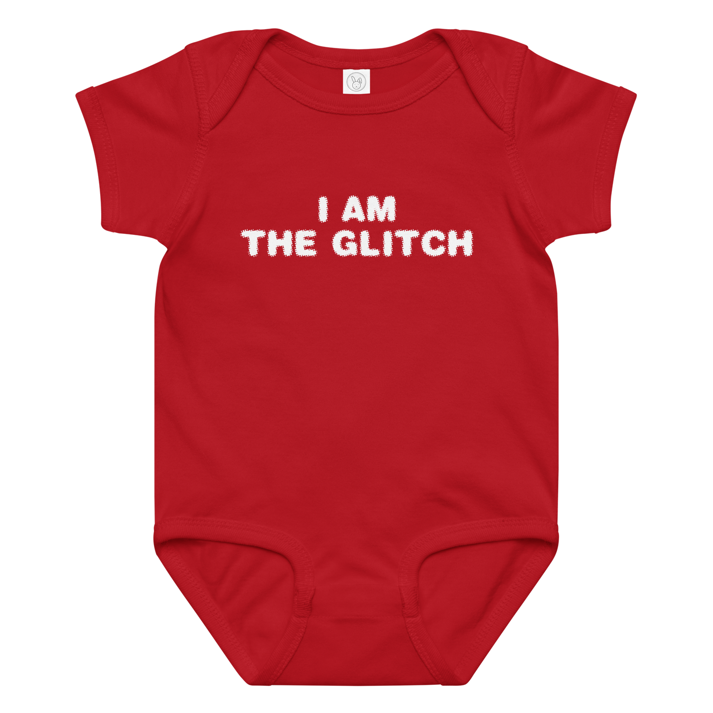 "I am the glitch" printed on a red baby jersey bodysuit laying on a flat surface amongst other clothes