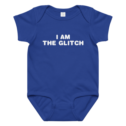 "I am the glitch" printed on a royal baby jersey bodysuit laying on a flat surface amongst other clothes