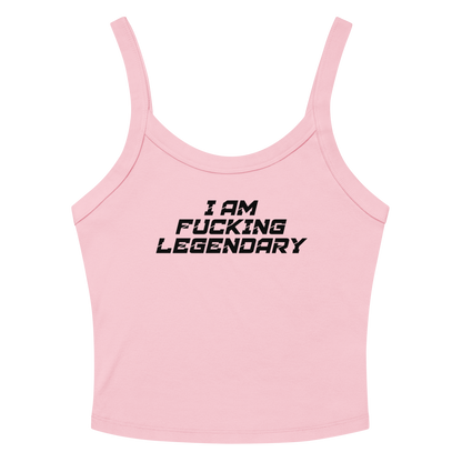 "I Am Fucking Legendary" printed on a solid pink blend women's micro-rib tanktop laying on a flat surface amongst sunglasses and shorts