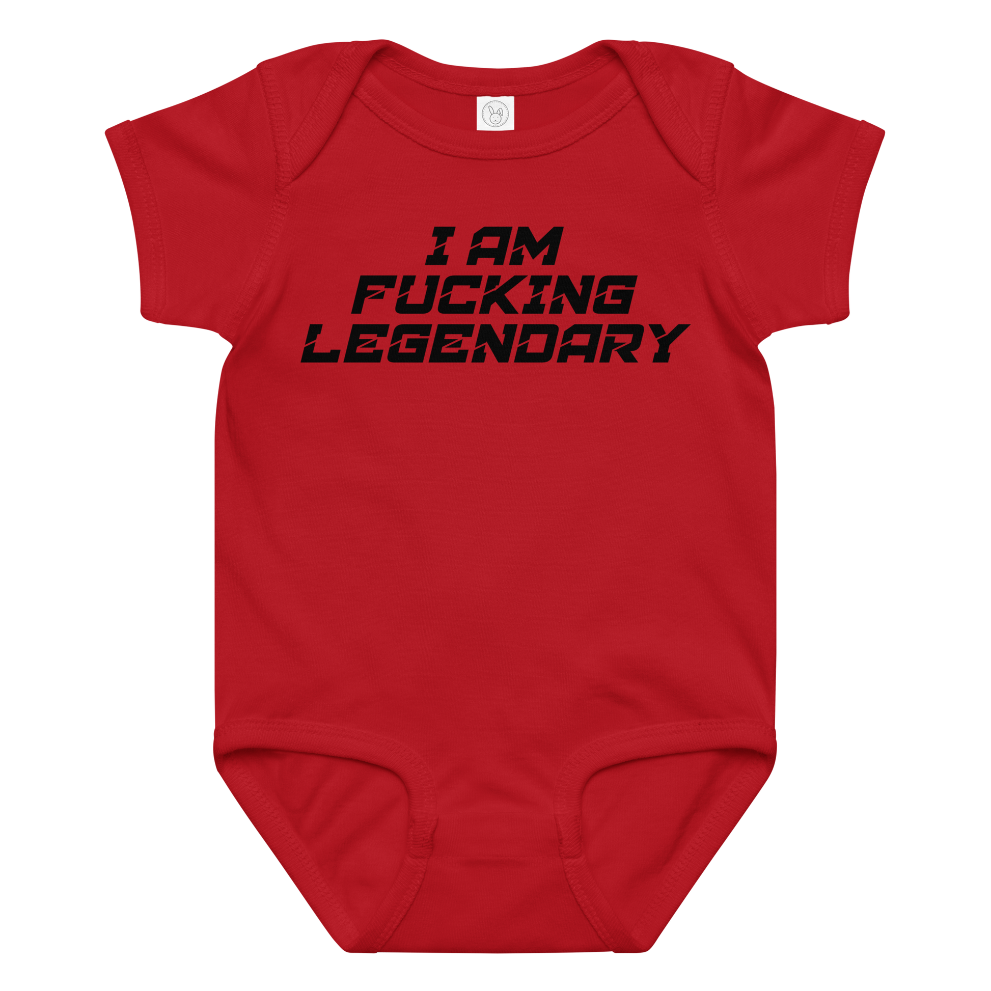 "I Am Fucking Legendary" printed on a red baby jersey bodysuit laying on a flat surface amongst other clothes