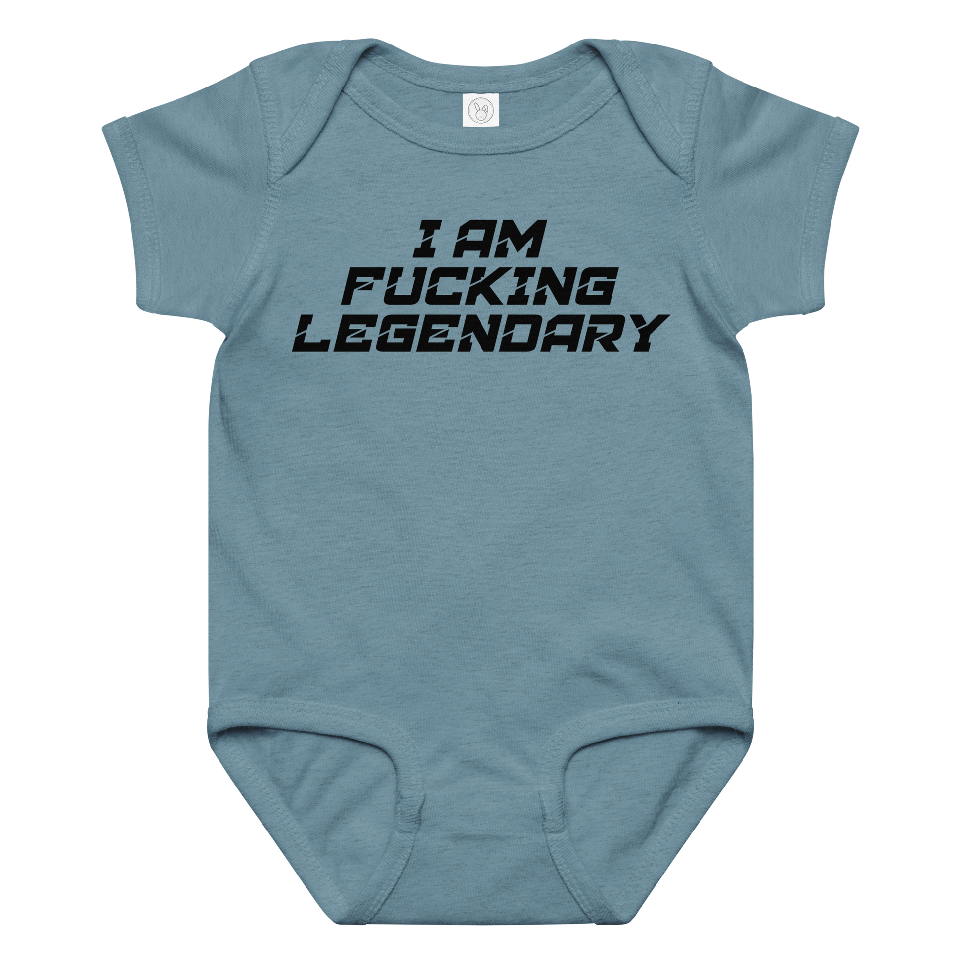 "I Am Fucking Legendary" printed on a vintage indigo baby jersey bodysuit laying on a flat surface amongst other clothes