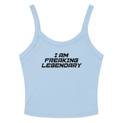 "I Am Freaking Legendary" printed on a solid baby blue blend women's micro-rib tanktop laying on a flat surface amongst sunglasses and shorts