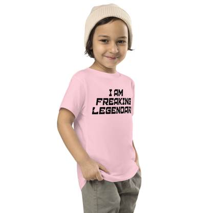 "I Am Freaking Legendary" printed on a pink toddler short sleeve tee worn by a male who is also wearing a knit cap