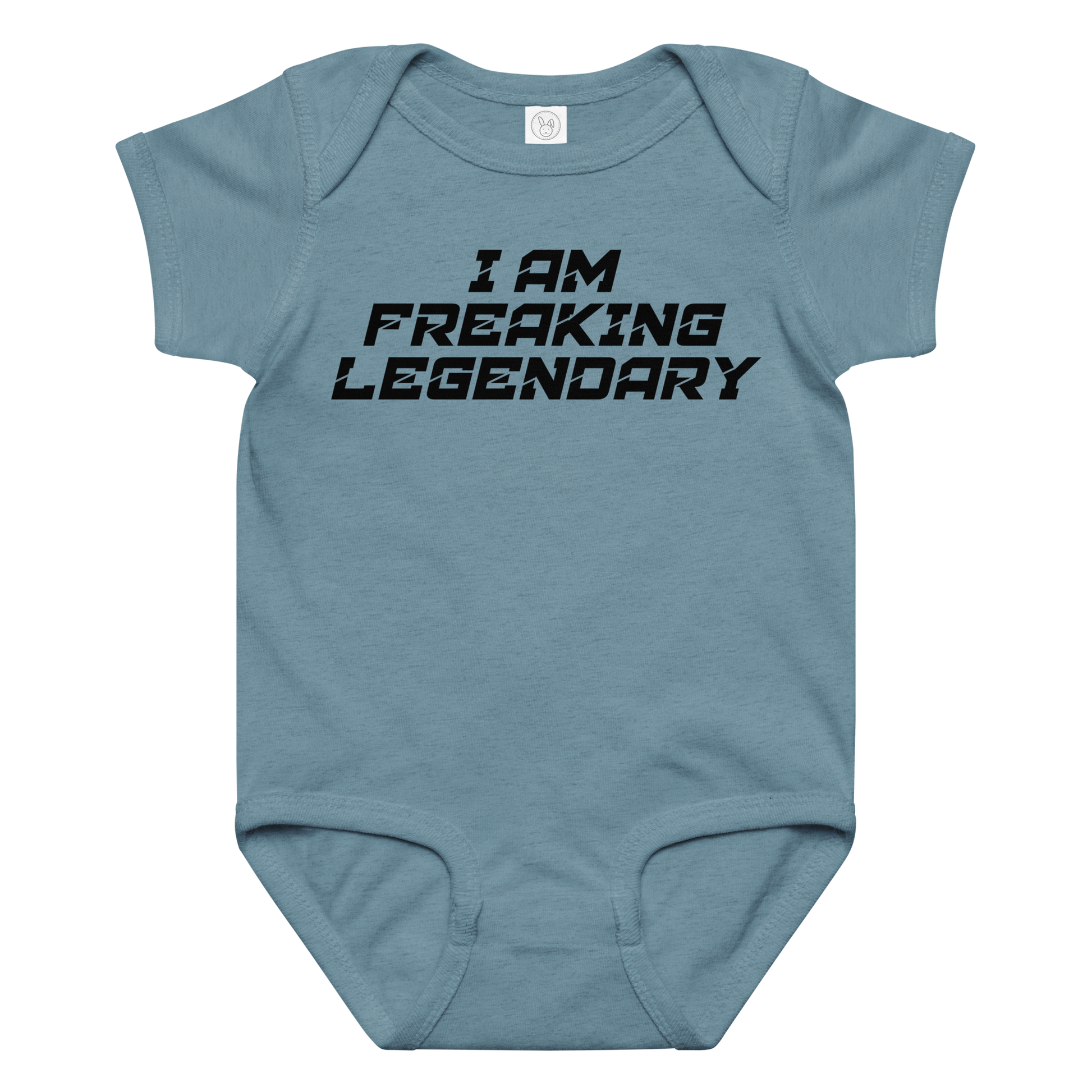 "I Am Freaking Legendary" printed on a vintage indigo baby jersey bodysuit laying on a flat surface amongst other clothes