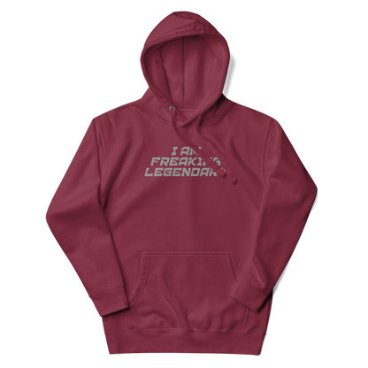 "I Am Freaking Legendary" printed on a maroon unisex hoodie laying on a flat surface with the hood up