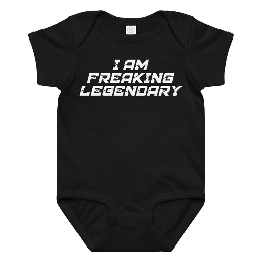 "I Am Freaking Legendary" printed on a black baby jersey bodysuit laying on a flat surface amongst other clothes