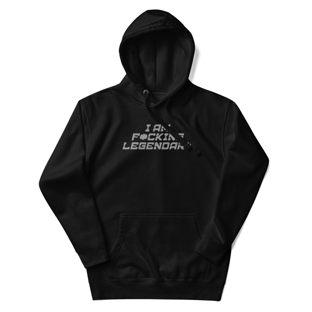 "I Am F*cking Legendary" printed on a black unisex hoodie laying on a flat surface with the hood up