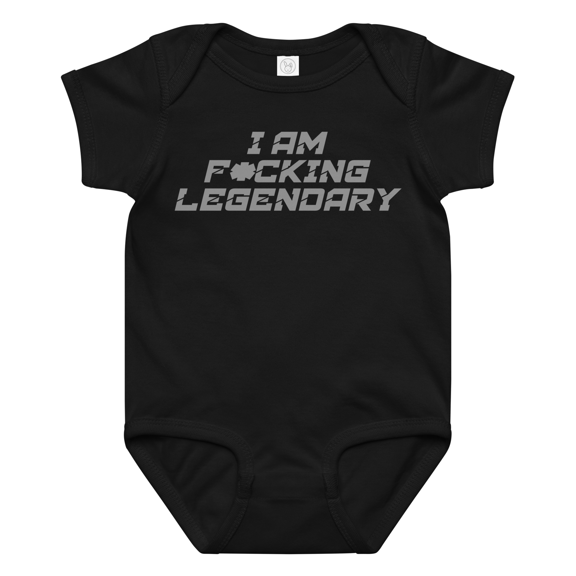 "I Am F*cking Legendary" printed on a black baby jersey bodysuit laying on a flat surface amongst other clothes
