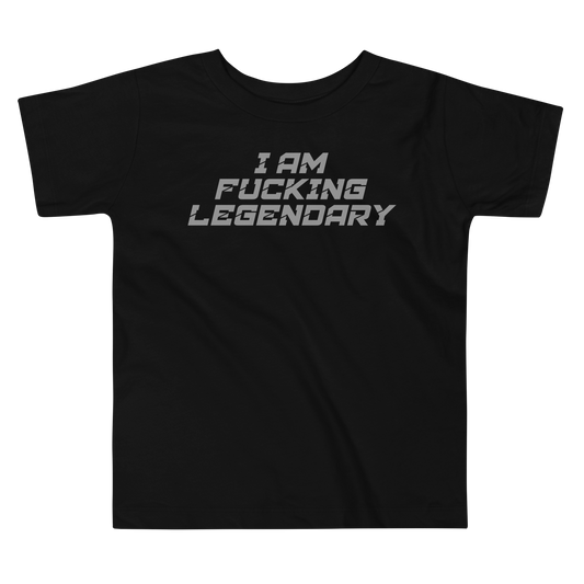 "I Am Fucking Legendary" printed on a black toddler short sleeve tee laying on a flat surface