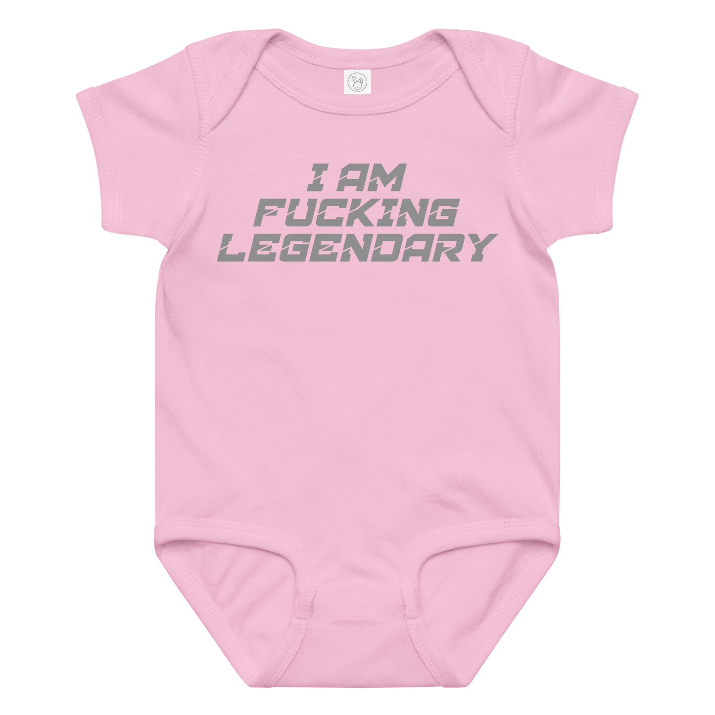 "I Am Fucking Legendary" printed on a pink baby jersey bodysuit laying on a flat surface amongst other clothes