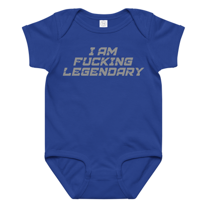 "I Am Fucking Legendary" printed on a royal baby jersey bodysuit laying on a flat surface amongst other clothes