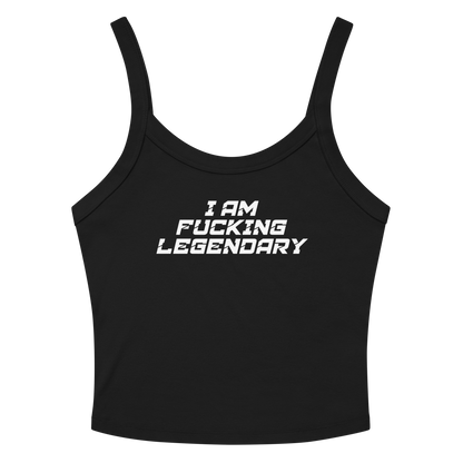 "I Am Fucking Legendary" printed on a solid black blend women's micro-rib tanktop laying on a flat surface amongst sunglasses and shorts