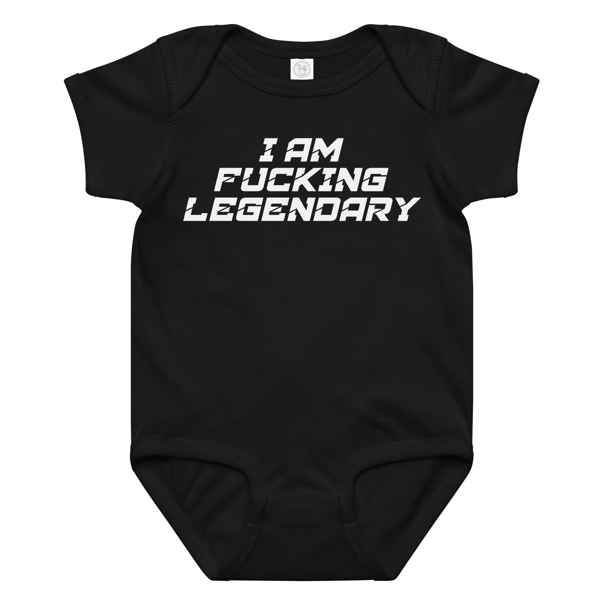"I Am Fucking Legendary" printed on a black baby jersey bodysuit laying on a flat surface amongst other clothes