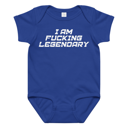 "I Am Fucking Legendary" printed on a royal baby jersey bodysuit laying on a flat surface amongst other clothes