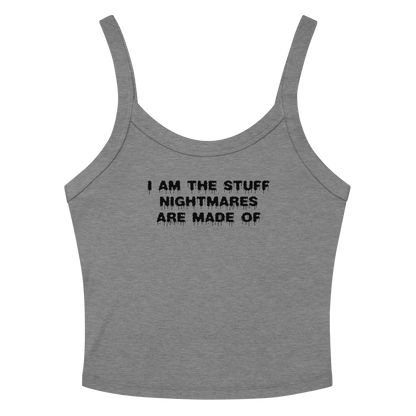 "I am the stuff nightmares are made of" printed on a athletic heather women's micro-rib tanktop laying on a flat surface amongst sunglasses and shorts