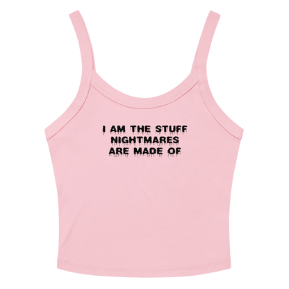"I am the stuff nightmares are made of" printed on a solid pink blend women's micro-rib tanktop laying on a flat surface amongst sunglasses and shorts