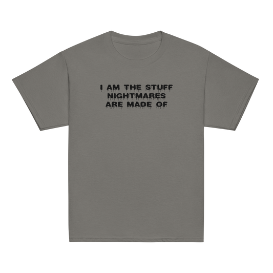 "I am the stuff nightmares are made of" printed on a charcoal youth classic tee laying on a flat surface