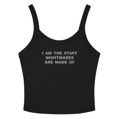 "I am the stuff nightmares are made of" printed on a solid black blend women's micro-rib tanktop laying on a flat surface amongst sunglasses and shorts