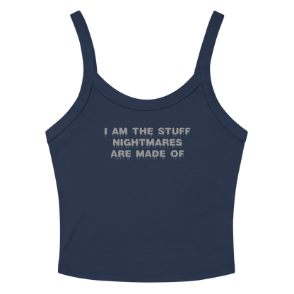 "I am the stuff nightmares are made of" printed on a solid navy blend women's micro-rib tanktop laying on a flat surface amongst sunglasses and shorts