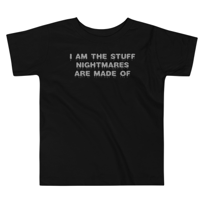 "I am the stuff nightmares are made of" printed on a black toddler short sleeve tee laying on a flat surface