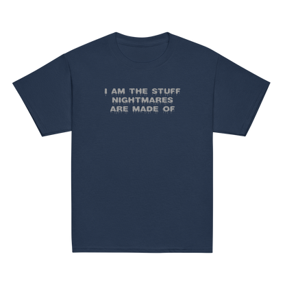 "I am the stuff nightmares are made of" printed on a navy youth classic tee laying on a flat surface