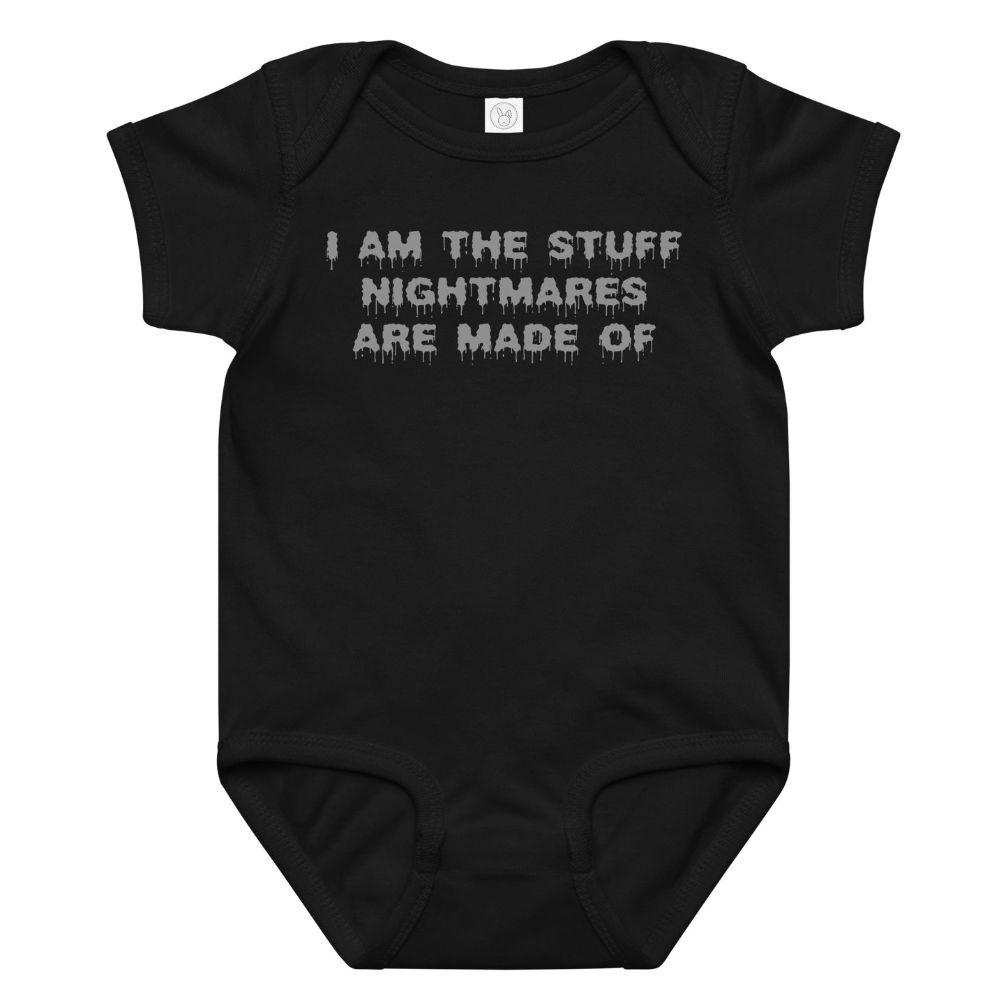 "I am the stuff nightmares are made of" printed on a black baby jersey bodysuit laying on a flat surface amongst other clothes